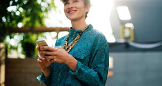 A woman holding her phone