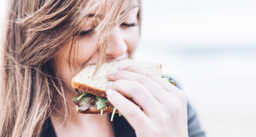 A woman eating a sandwich
